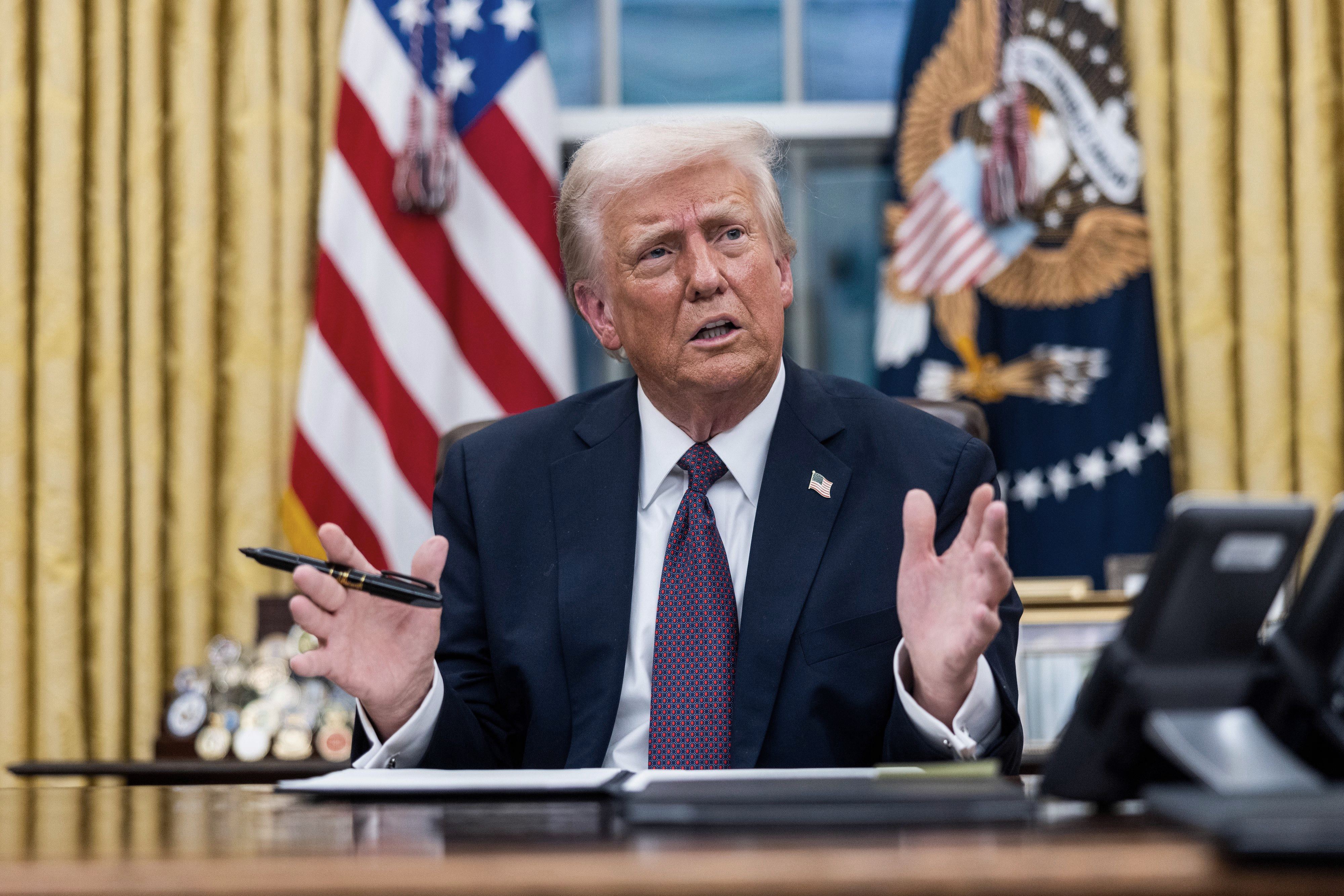 President Trump signs executive orders in the oval office in Washington - 20 Jan 2025