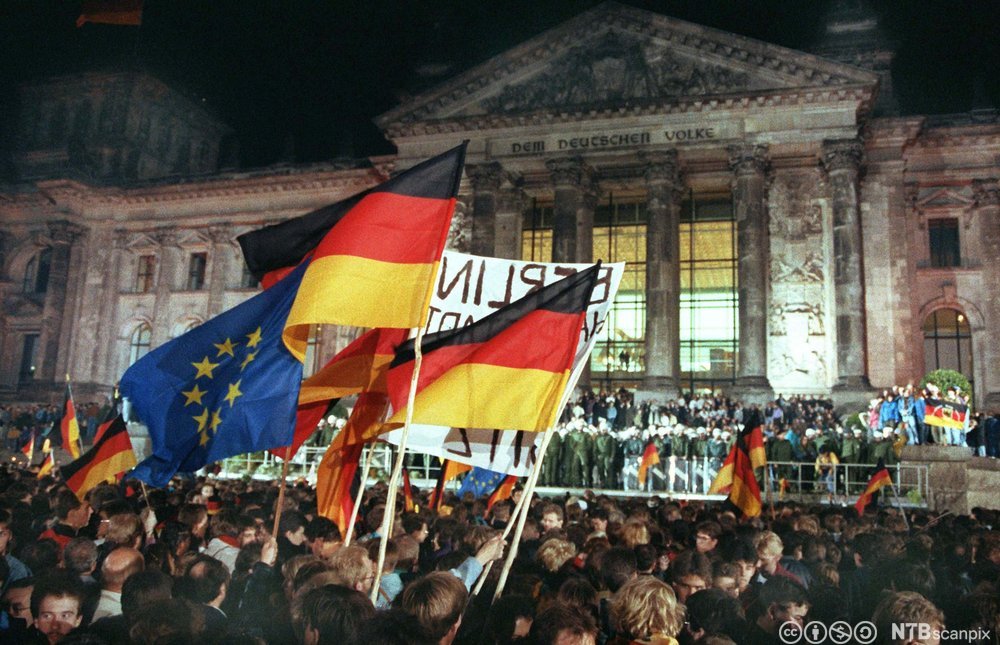 Celebration of German reunification outside the Reichstag building in Berlin on the night of October 3, 1990.