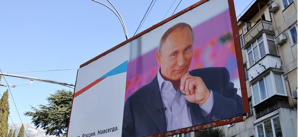 YALTA - MAR 07: Street billboard - Russia's President Vladimir Putin