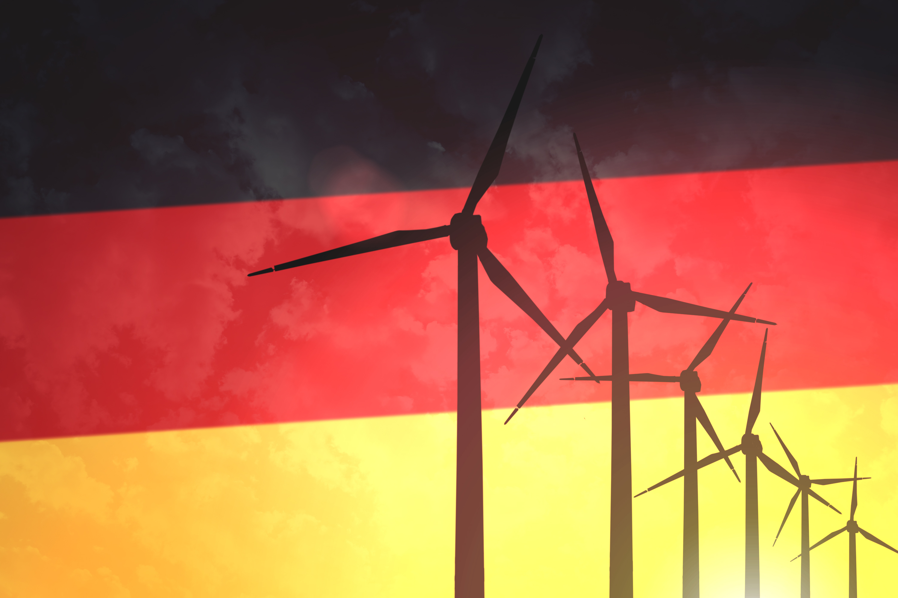 Wind turbines on the background of the flag of Germany